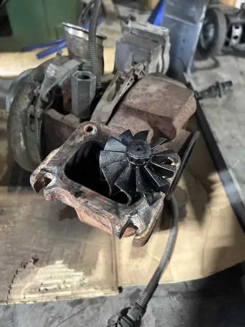 Worn turbocharger with a damaged compressor wheel